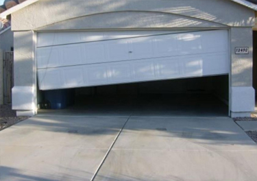 garage door off track repair in in Sylmar